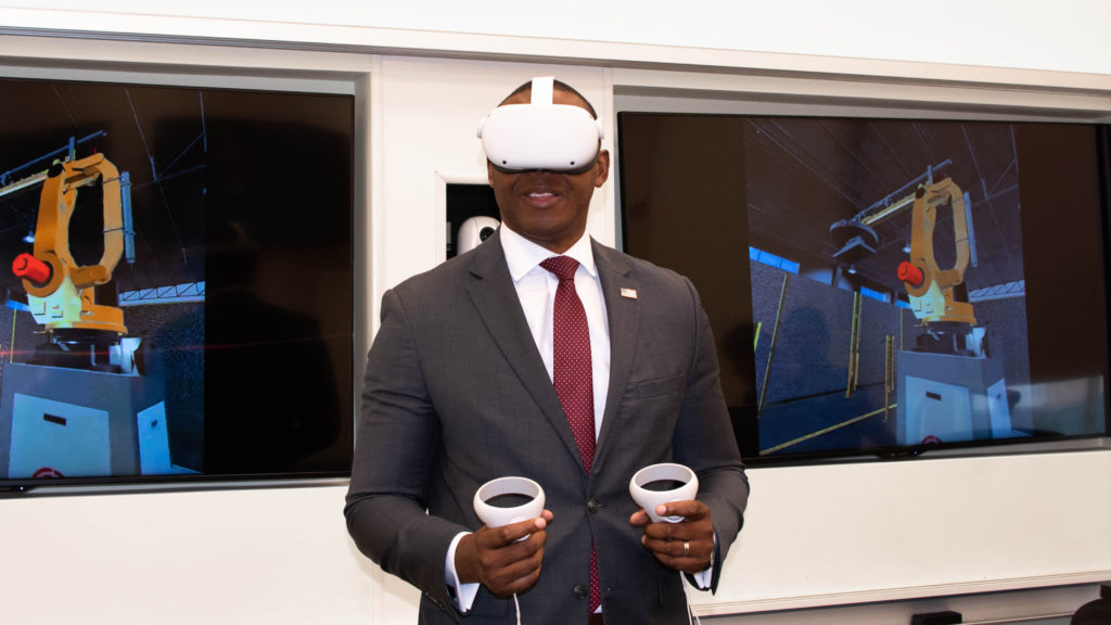 Mr. Chike Aguh, Chief Innovation Officer at the U.S. Department of Labor, tries the ARM Institute's VR Robotics Technician Credential Assessment