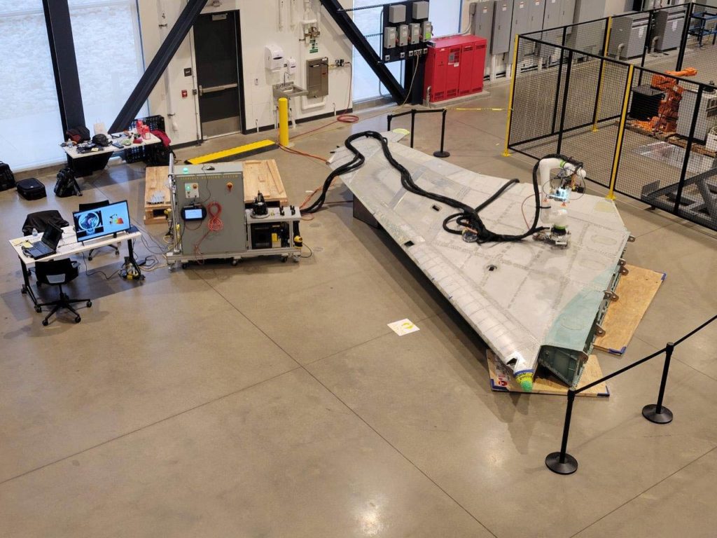 An ARM Institute robotics project works on an F-15 wing at Mill 19