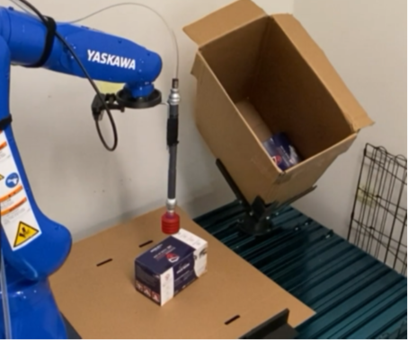 Robot arm picks up a box of disposable masks
