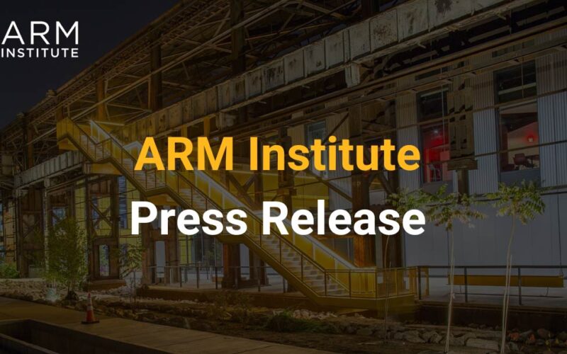 The ARM Institute Mill 19 facility sits behind text that says "ARM Institute Press Release"
