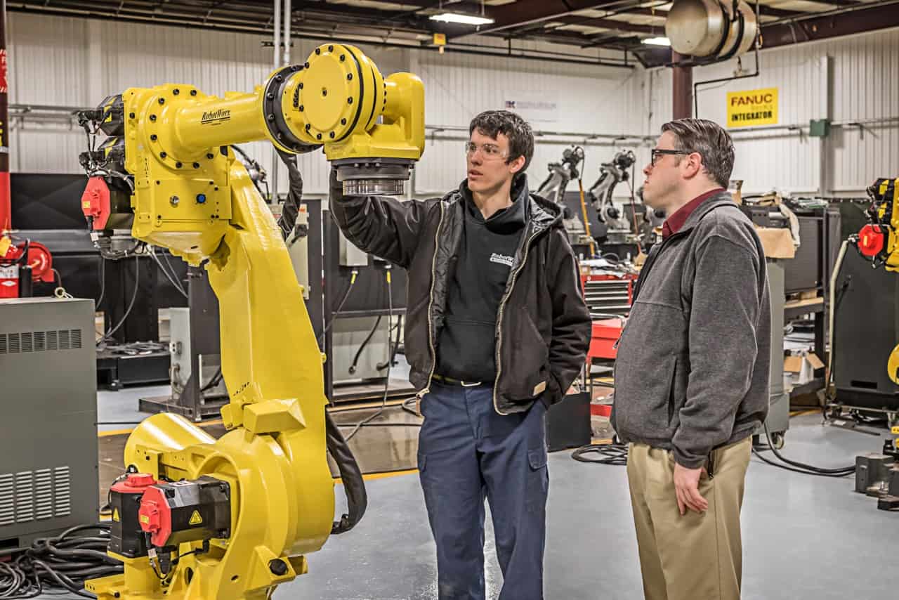 Student and Instructor Inspect Robot