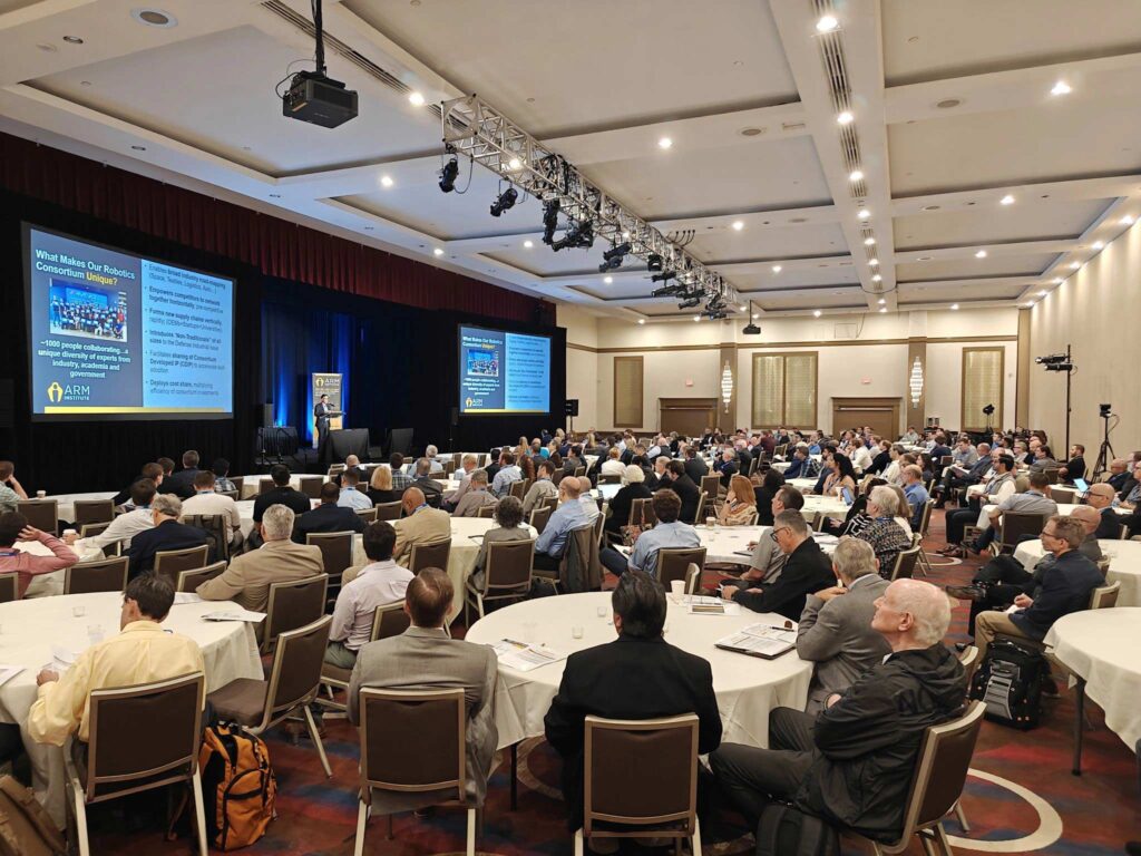 ARM Members gather watching two screens