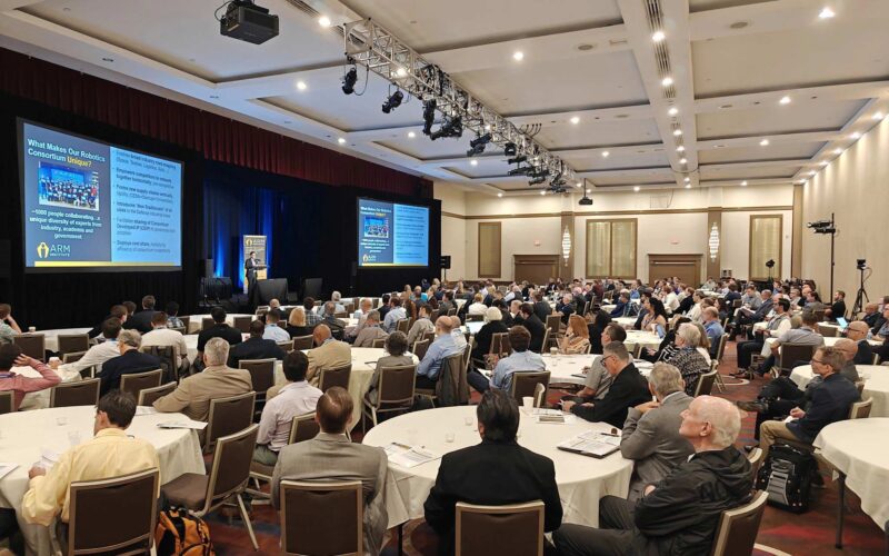 ARM Members gather watching two screens