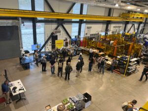 People take tours of robotics demonstrations