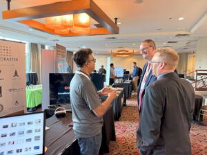A team from GridRaster showcases their technology to Mr. Holthe and Jorgen Pedersen