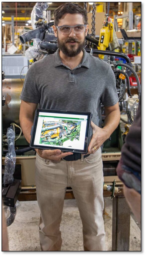 Image of Kevin holding a tablet