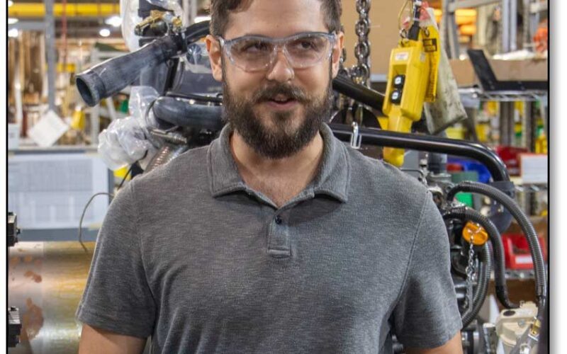 Image of Kevin holding a tablet