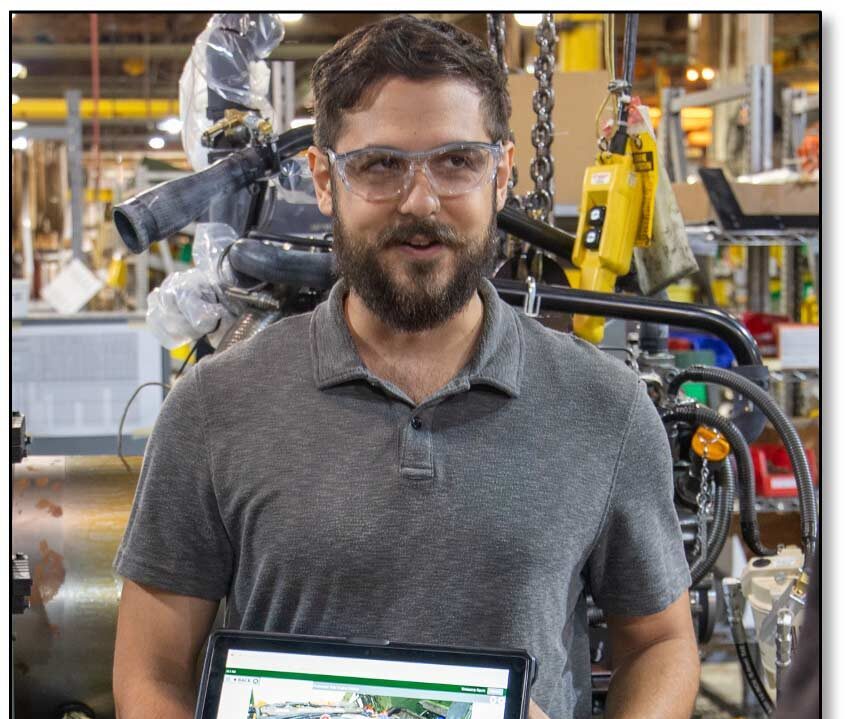 Image of Kevin holding a tablet