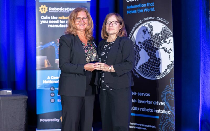 Suzy and Terri pose with a Champion Award