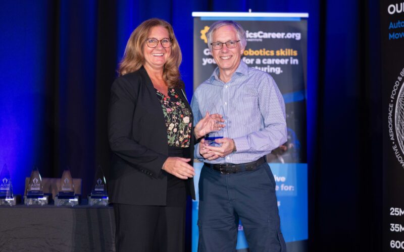 Photo of Glenn receiving his Champion award