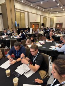 A group of people work together at a table
